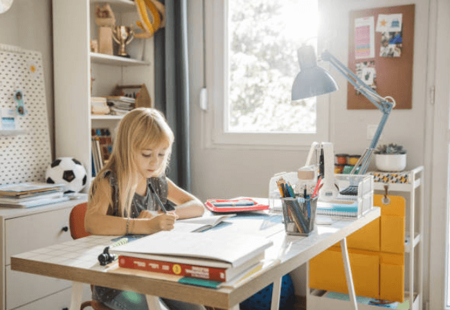 girl working at desk homework and study space